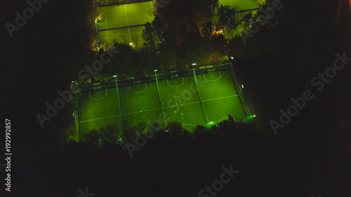 Footbal soccer field night aerial. Clip. Birds eye view of a soccer football court. Top view of the football field at night photo