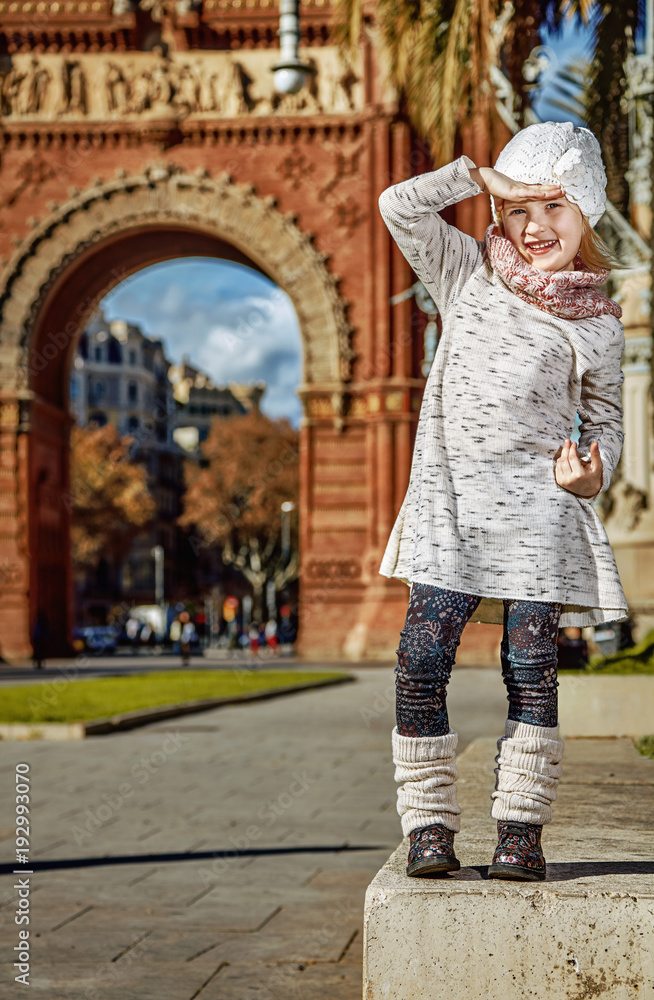 girl near Arc de Triomf in Barcelona looking into distance girl near Arc de Triomf in Barcelona looking into distance