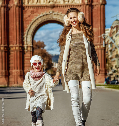 mother and daughter near Arc de Triomf in Barcelona walking