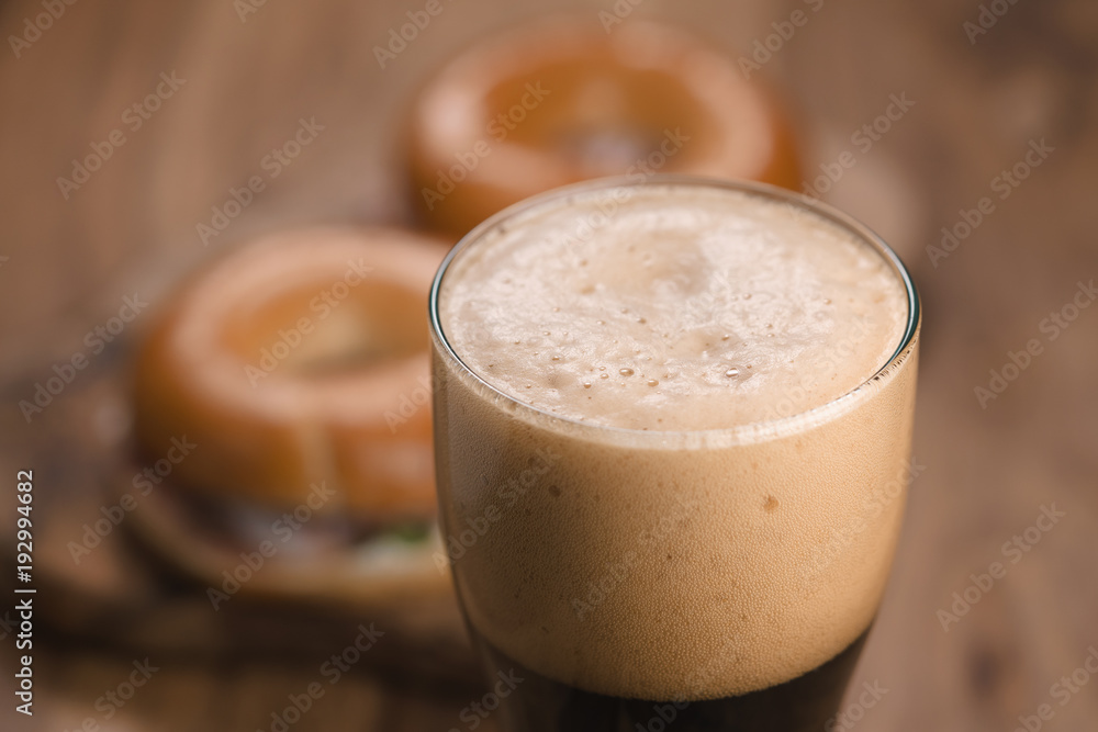 glass of stout beer agains bagels with ham glass of stout beer agains bagels with ham