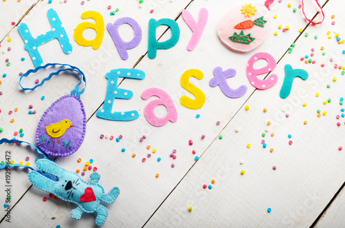 Canvas Print Happy Easter phrase made of fabric letters on white table