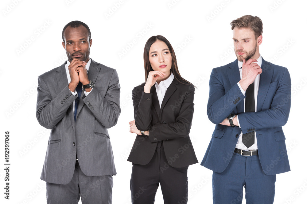 portrait of pensive multicultural young business people isolated on white portrait of pensive multicultural young business people isolated on white