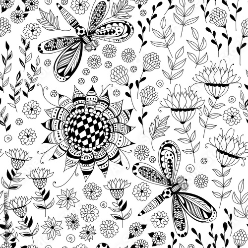 Dragonflies and various doodled flowers and leaves in black and white. Seamless pattern for design.