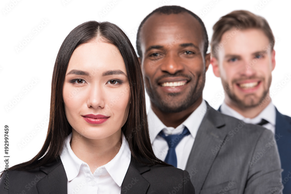 portrait of smiling multicultural young business people isolated on white portrait of smiling multicultural young business people isolated on white