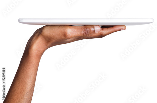 Black woman holding digital tablet isolated, side view