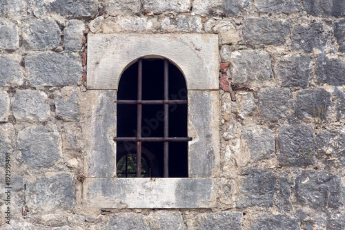 window with grate in old building in Montenegro