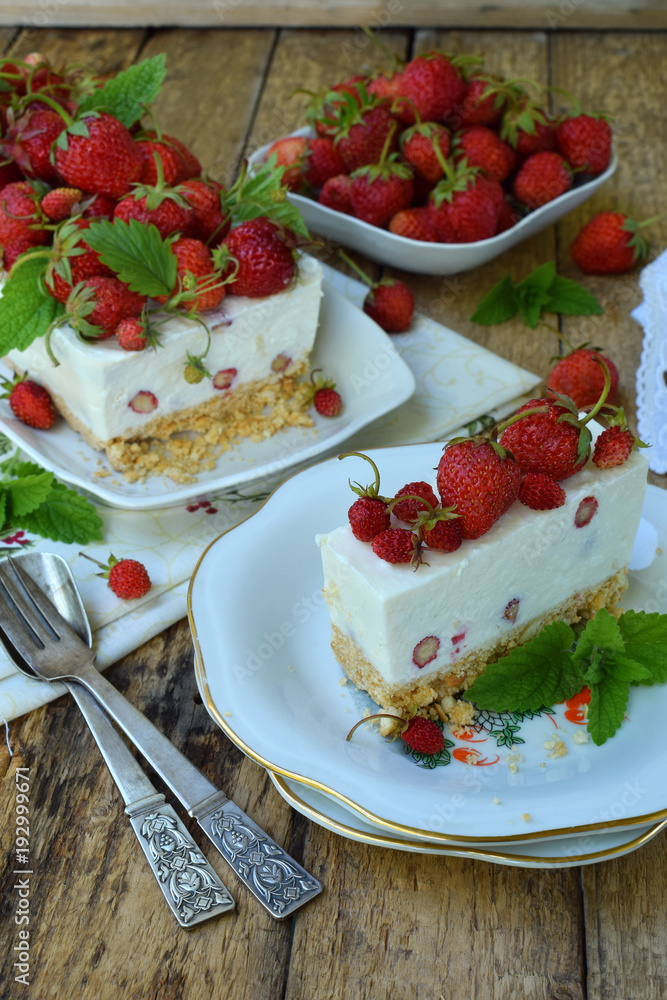 Cheesecake with berries, bio homemade strawberries from garden, delicious and simple cake on wooden background. Copy space for your text. Cheesecake with berries, bio homemade strawberries from garden, delicious and simple cake on wooden background. Copy space for your text.