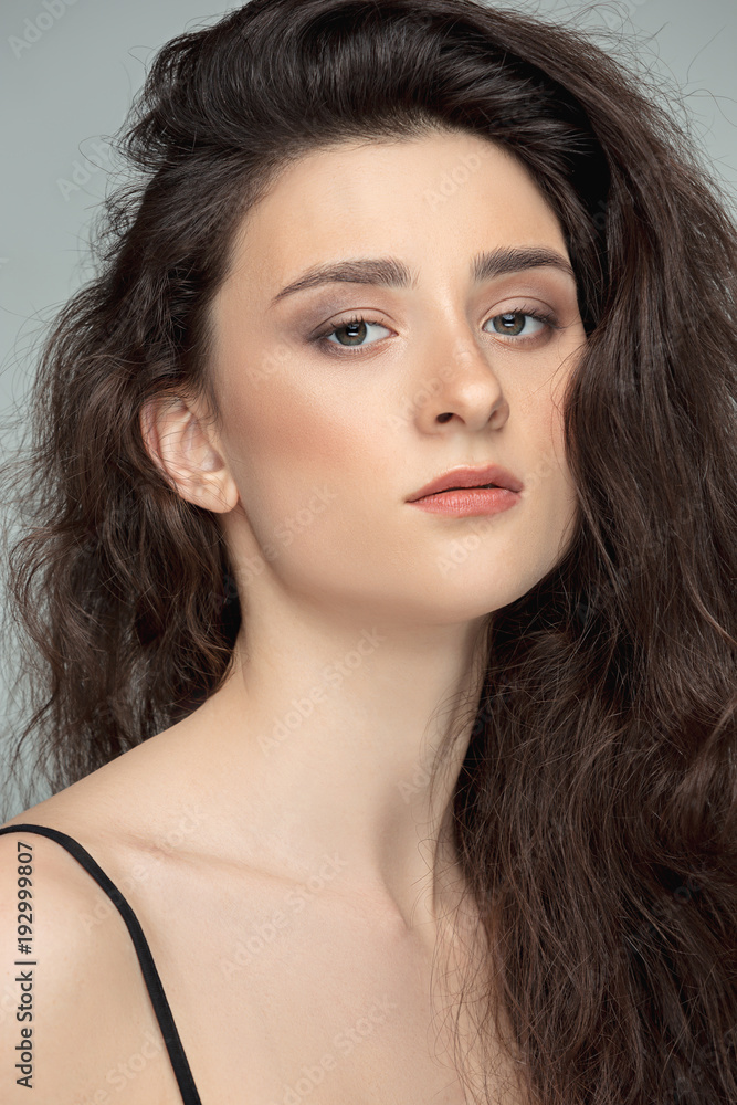 Fototapeta premium Beauty portrait of a charming woman looking at camera