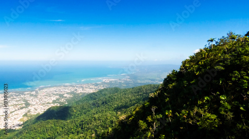 An amazing view of Puerto Plata, the Atlantic Ocean and a lot of tropical trees from the top of Mount Isabel de Torres, Dominican Republic. photo