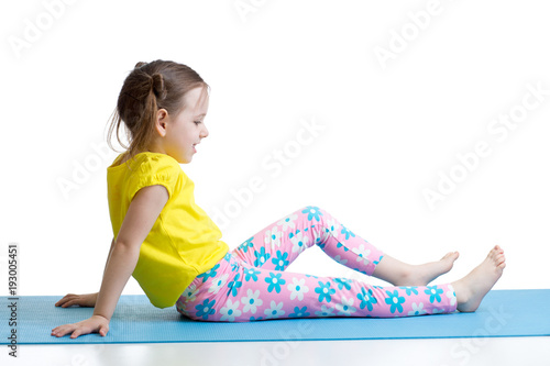 Child doing fitness exercis...