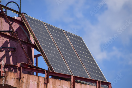 Solar panels at the top of the lighthouse. Transformation of solar energy photo