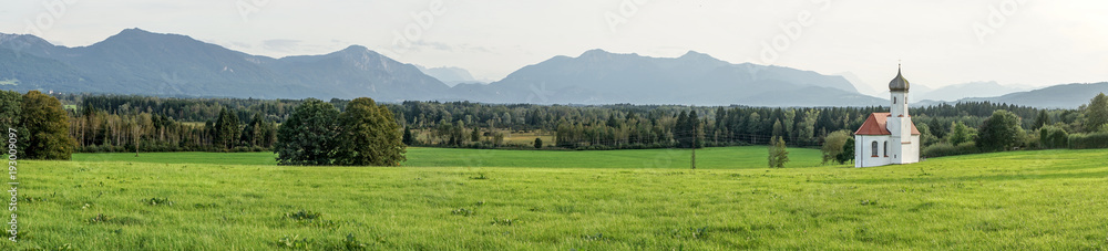 Fototapeta premium small church in Bavaria / Beautiful landscape with Church of St. Johann in Penzberg, Bavaria, Germany 