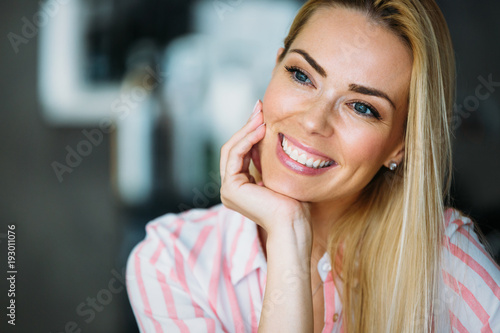Portrait of a beautiful blonde woman smiling.
