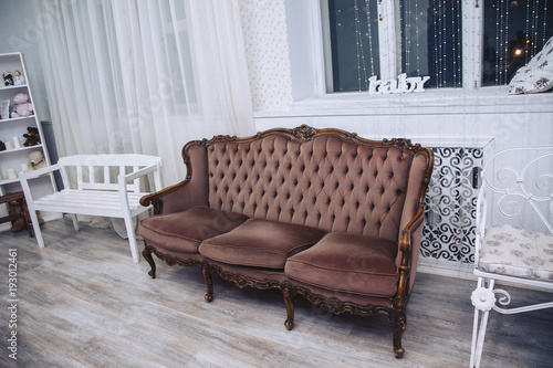 Luxurious brown sofa in a modern interior.