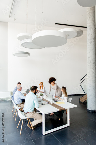 Business people around tabl...