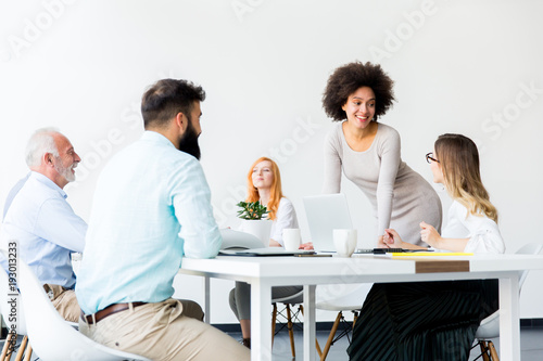 Business people around table during staff meeting