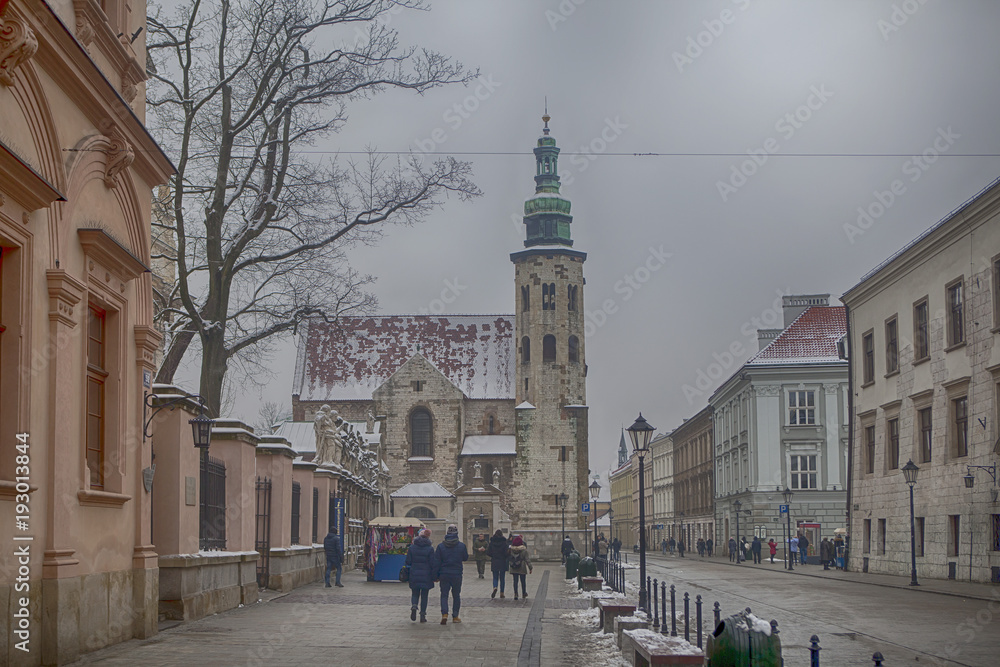 Grodzka street with St Andrew's church - obrazy, fototapety, plakaty 