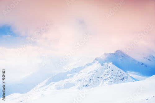Canvas Print Snow storm in the mountains at sunset