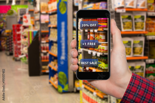 Augmented reality in marketing. Phone in hand, on screen information about prices and sales in food store
