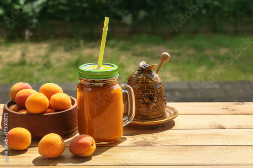 apricot smoothies with honey, honey and apricots on the table