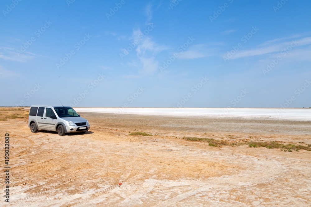 Flat plain, steppe, salt, salt lake, heat and sky - a typical landscape on the Arabatskaya arrow, the Ukrainian part of the Crimea Flat plain, steppe, salt, salt lake, heat and sky - a typical landscape on the Arabatskaya arrow, the Ukrainian part of the Crimea