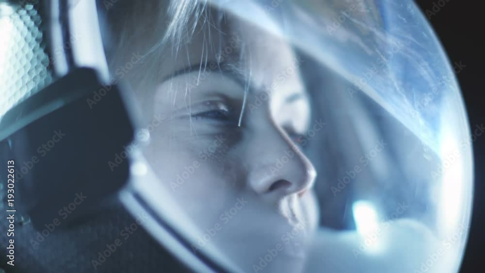 Portrait Shot of the Beautiful Female Astronaut Wearing in Space, Earth