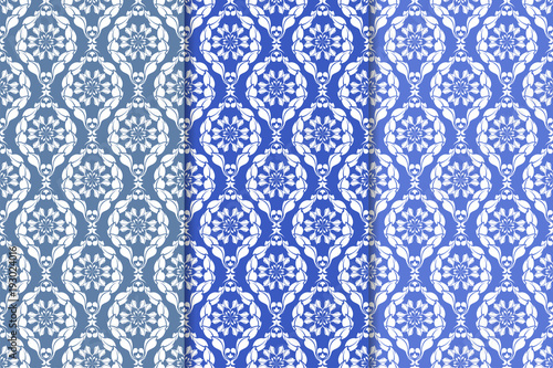 Set of floral ornaments. Vertical blue seamless patterns