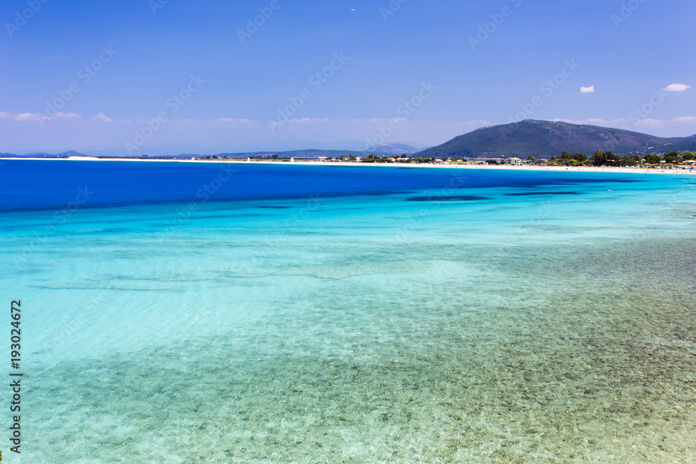 Turquoise waters of Agios Ioannis Beach of Lefkada, Greece, located at the Ionian Sea.
