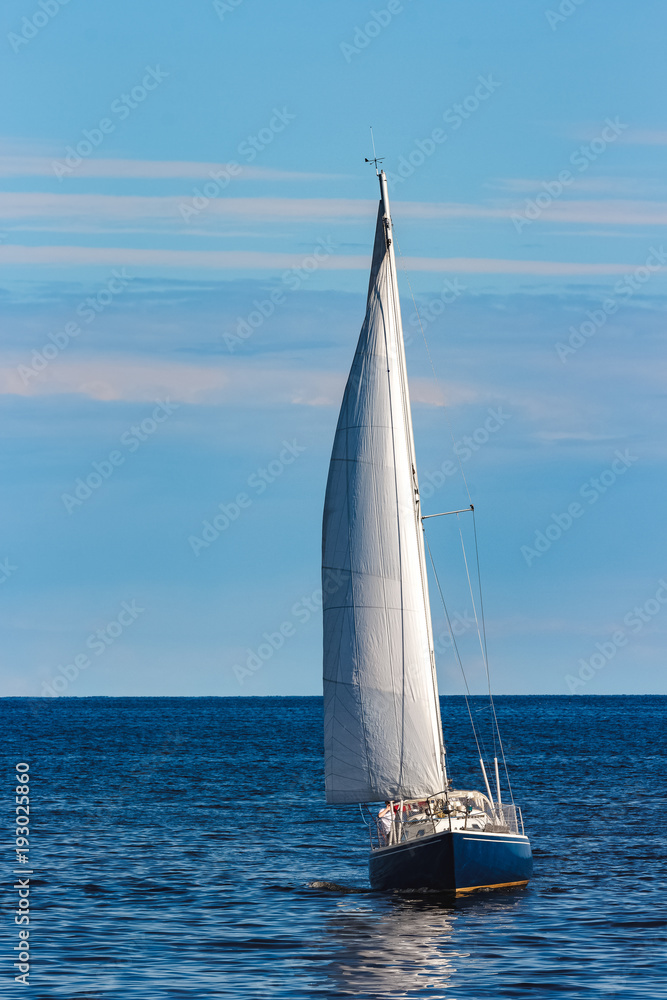 Blue sailboat at journey