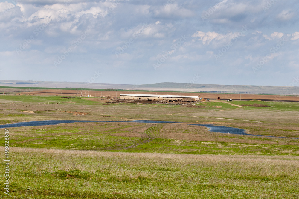 Typical steppe landscape with an old farm