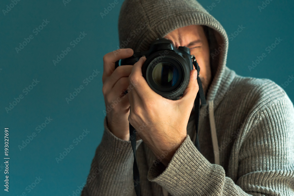 Photographer holding full frame sensor DSLR camera Photographer holding full frame sensor DSLR camera