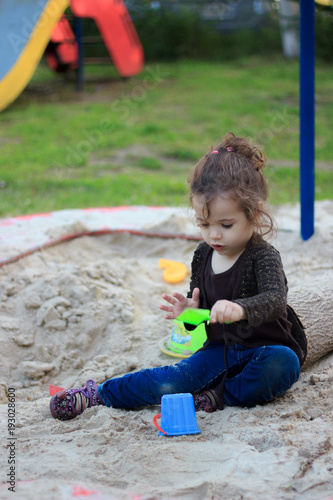 Little kid girl playing in ...