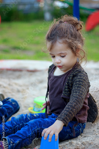 Little kid girl playing in ...