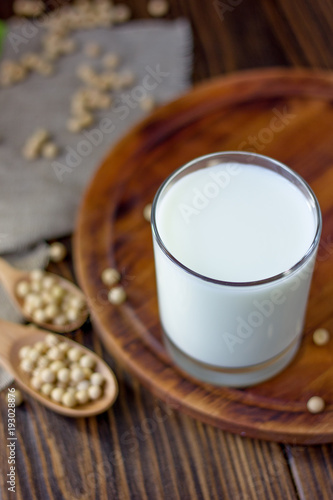 Soybean milk with soy beans around it