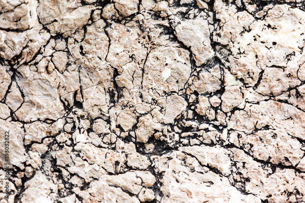 Empty gray stone wall covered with cracks of old house. Empty gray stone wall covered with cracks of old house.