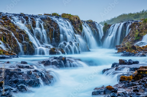 Fototapeta Naklejka Na Ścianę i Meble -  Dramatic views of the bright Bruarfoss waterfall. Popular tourist attraction. Location place South Iceland, Europe.