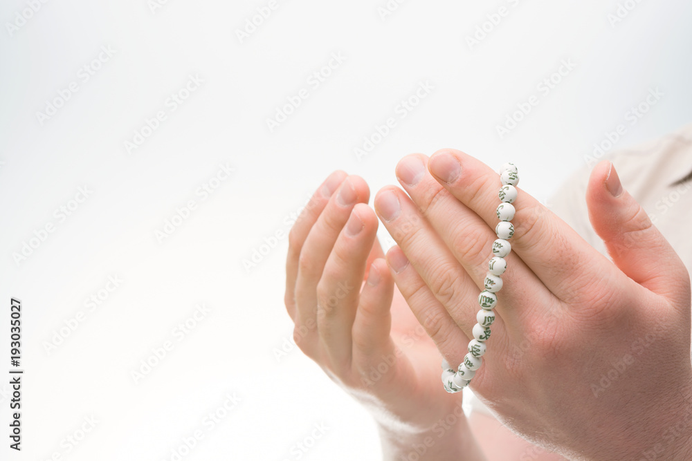 Hands with Muslim beads. Man praying Hands with Muslim beads. Man praying