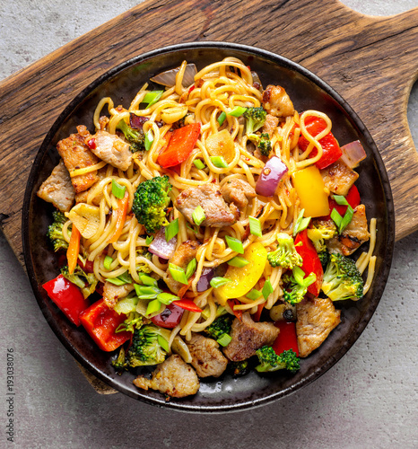 Plate of noodles with meat and vegetables