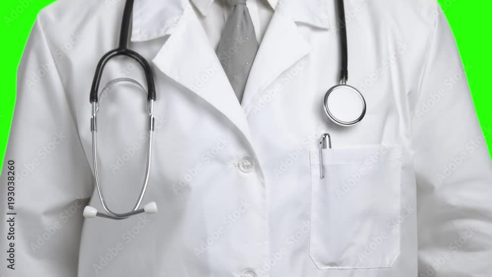 Close up doctor lays stethoscope around neck. Male doctor putting on stethoscope close up. Close up doctor lays stethoscope around neck. Male doctor putting on stethoscope close up.