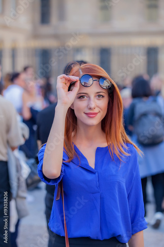 Young girl in sunglasses at Parisian streets