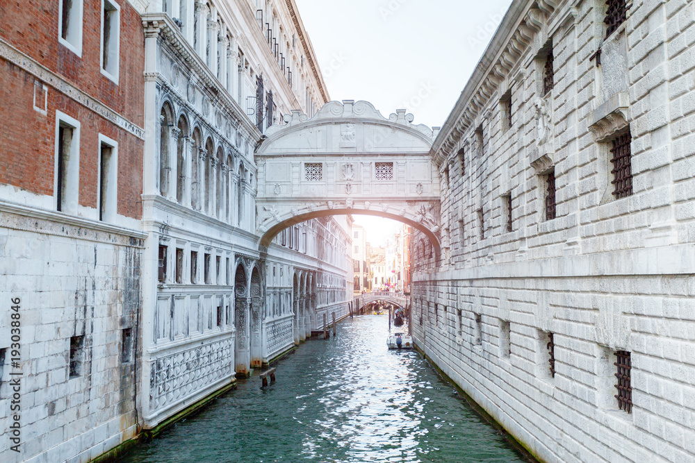 Beautiful view of the bridge of sighs in Venice in gentle pastel colors with rays of sunlight. Italy