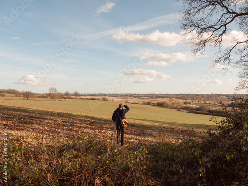 view of person looking out of large expanse space field agriculture nature landscape © Callum