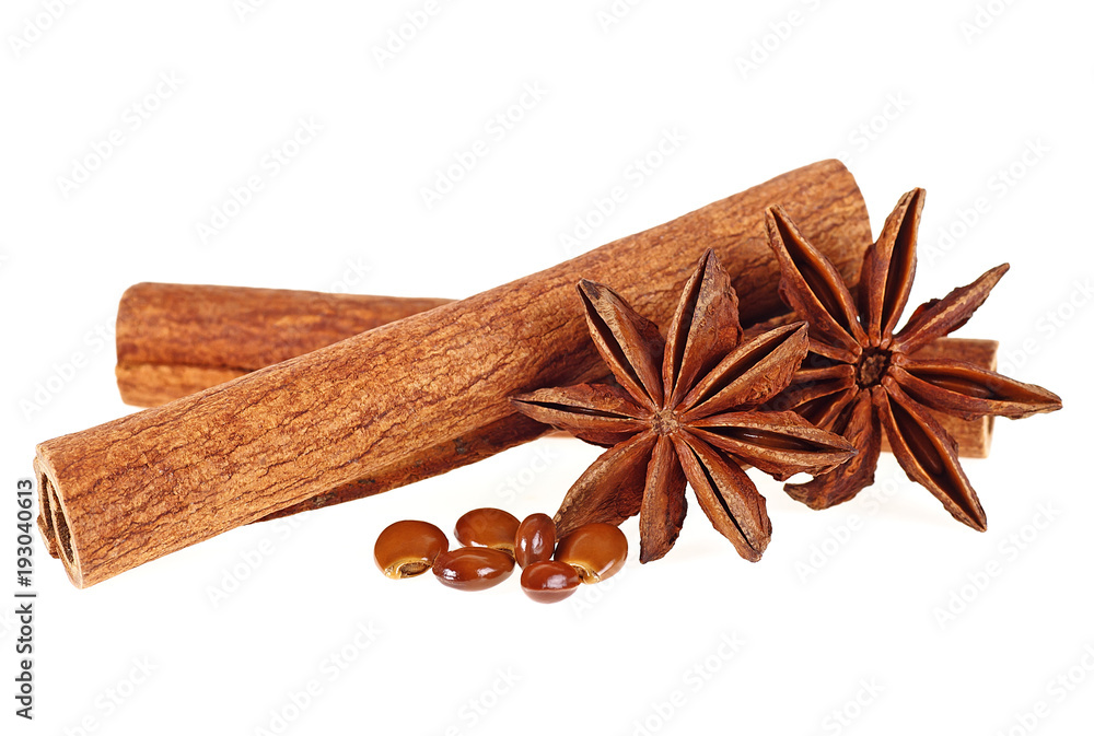 Cinnamon sticks and anise stars on a white background Cinnamon sticks and anise stars on a white background