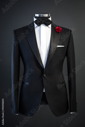 Fotografie, Obraz Tailored suit, tuxedo isolated on black background on mannequin