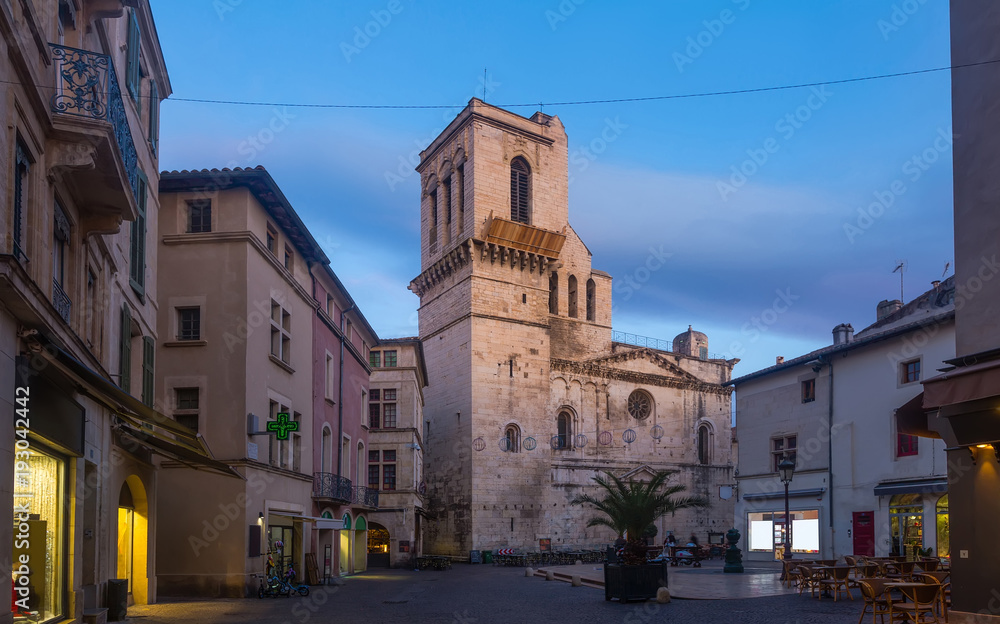 Night view of Nimes streets and building illuminated at dusk