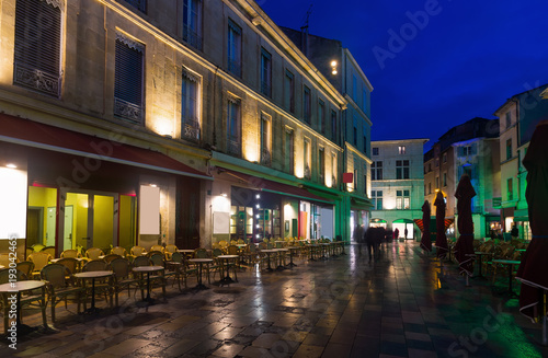 Night view of Nimes streets and building illuminated at dusk © JackF