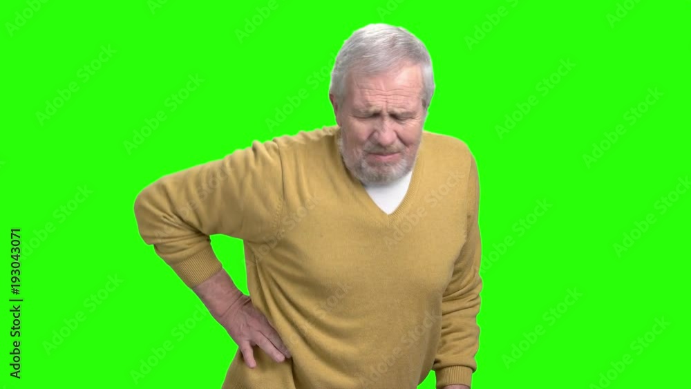 Man having problem with back. Unhappy senior man suffering from pain in his back, chroma key background. Man having problem with back. Unhappy senior man suffering from pain in his back, chroma key background.