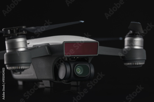 Dji Spark mini drone quadcopter isolated on black