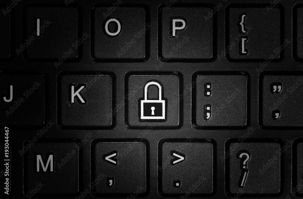 Button with the symbol of the closed lock on the keyboard. Concept of network security, virus protection, data protection. Button with the symbol of the closed lock on the keyboard. Concept of network security, virus protection, data protection.