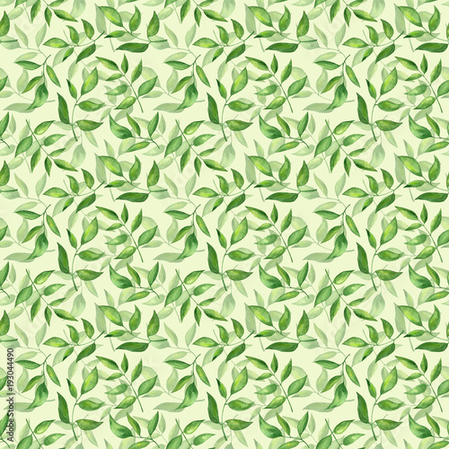  Seamless pattern with green fresh leaves on yellow background